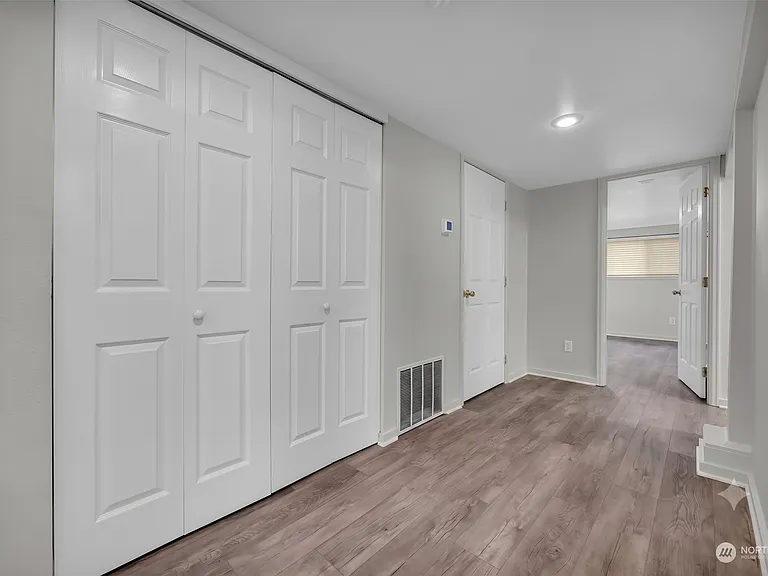 Hallway - double door opens to laundry room; single door opens to large storage closet with furnace and water heater (50G dedicated to unit)