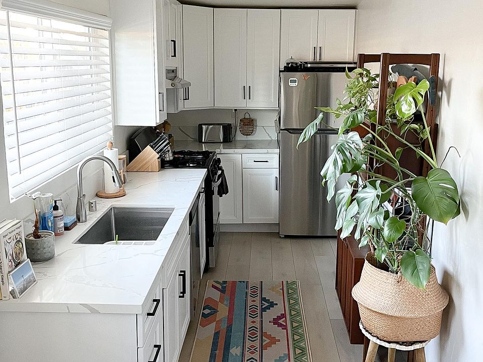 Kitchen with quartz counter tops, stainless steel appliances, including Fridge, Gas Stove, Dishwasher and ample storage space for your kitchen accessories