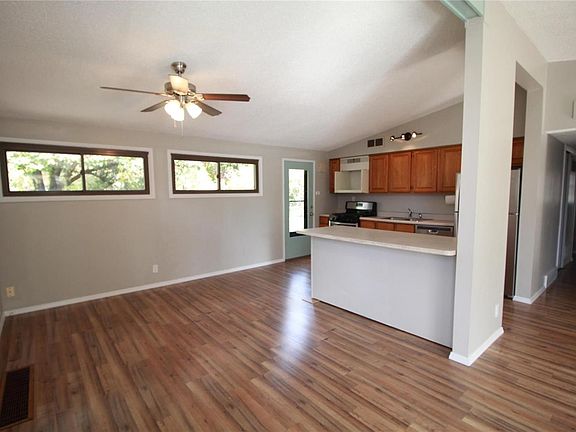 Dining area, breakfast bar and door to patio.