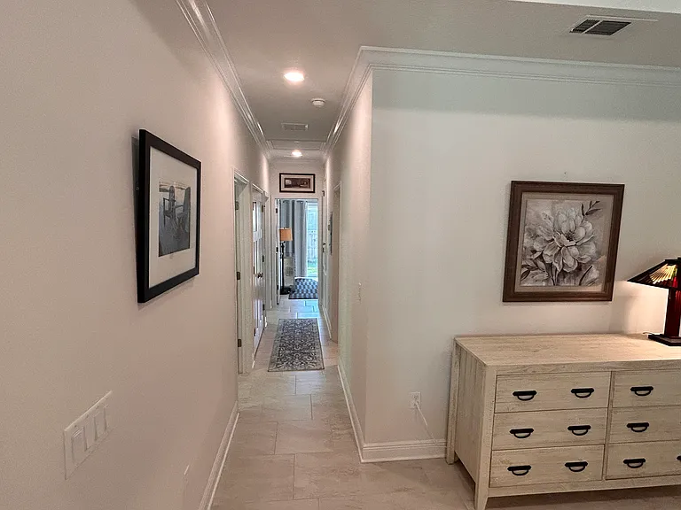 Hall with access to bedrooms 1 and 2 with view of owners suite entry