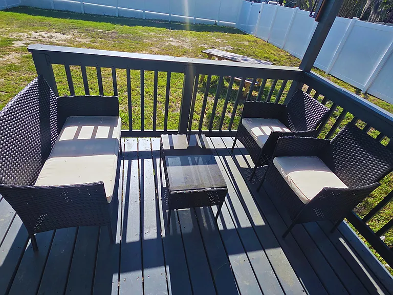 Bright open-air porch perfect for relaxing and unwinding