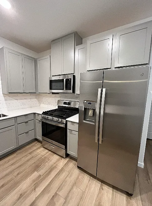 Modern Stainless Steel appliances including a gas range stove
