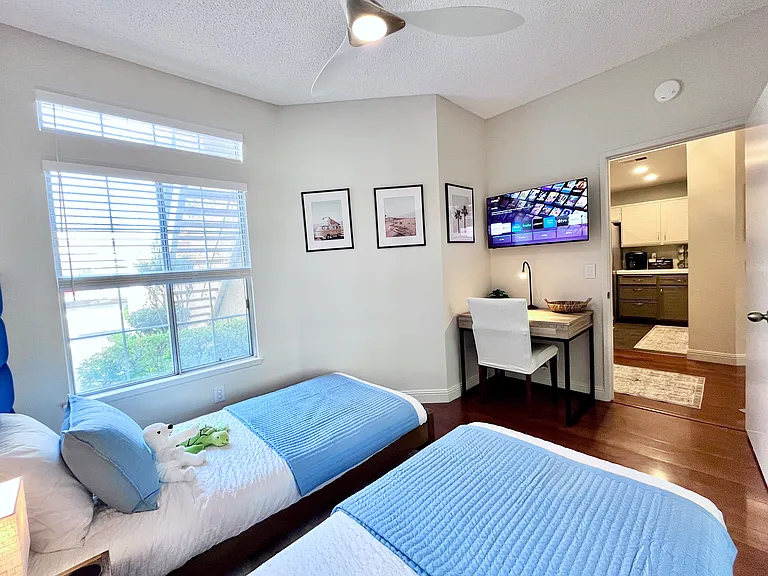 40" Smart TV, and a fully equipped workstation with desk light, ample table space, convenient outlet, and comfy chair perfect for work, relaxation, or giving kids a dedicated homework space.