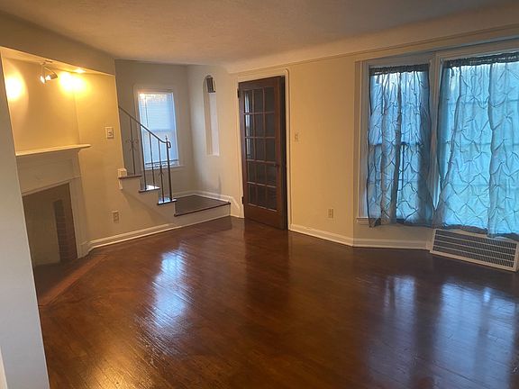 Front living room with non-working fireplace (decorative only). Cloat closet in the porch entryway.
