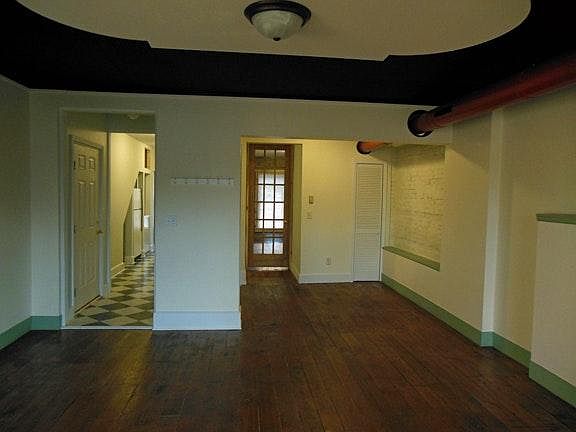 View from living room into kitchen and dining room