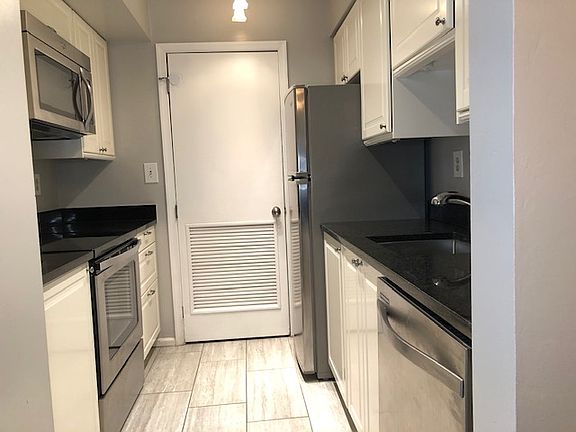 Washer Dryer next to kitchen area