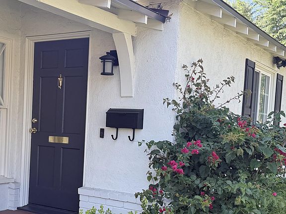 Front door with original Living room window