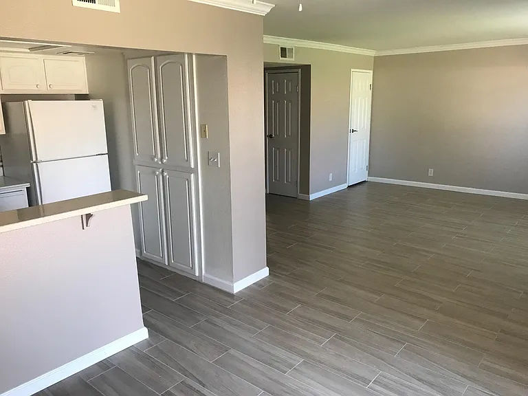 Dining room partial view of kitchen.