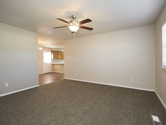 Living area has new carpet and paint.