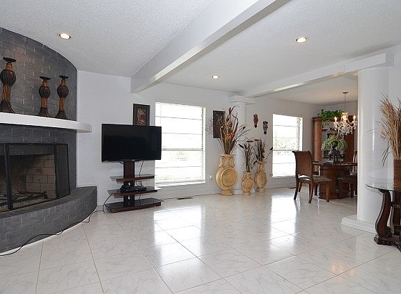 Beautiful tile floors and beamed ceiling