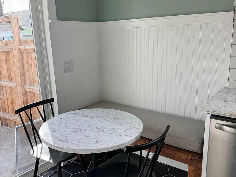 Breakfast/Dining nook in the kitchen. Chairs & table stay.