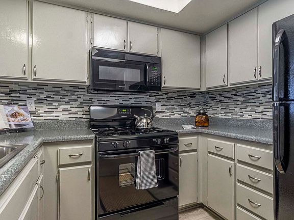Upgraded Kitchen with Tiled Backsplash