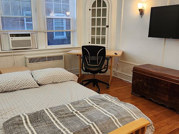 Futon converts to bed. The futon bed contains an additional mattress topper, pillows, and blanket.