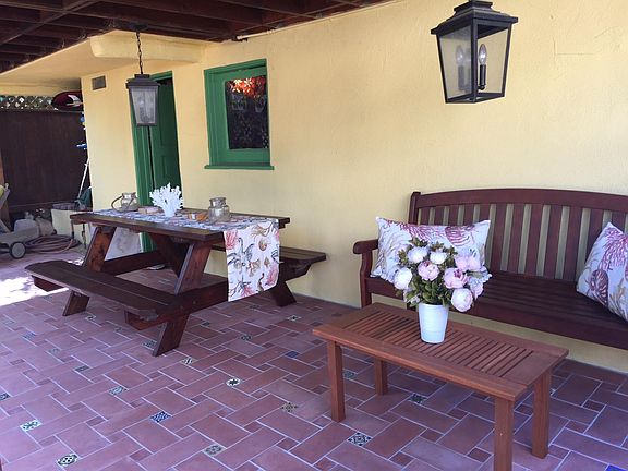 Downstairs patio with storage room.