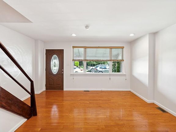 Spacious entryway and living room.