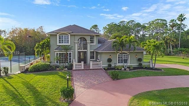 Front view of house and tennis court from above