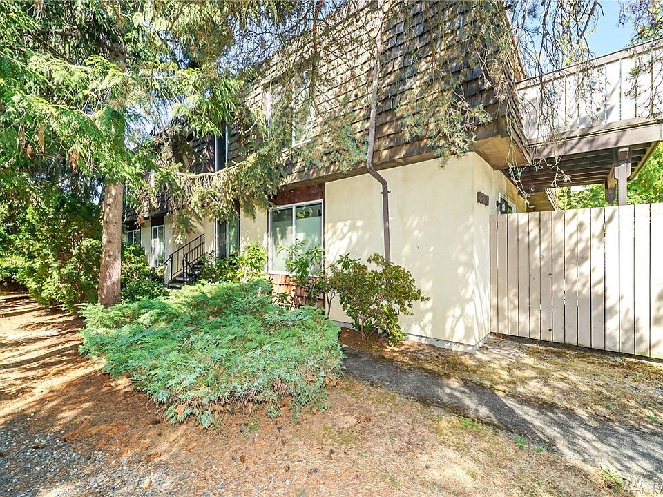 Welcome home to this peaceful setting among the surrounding trees!