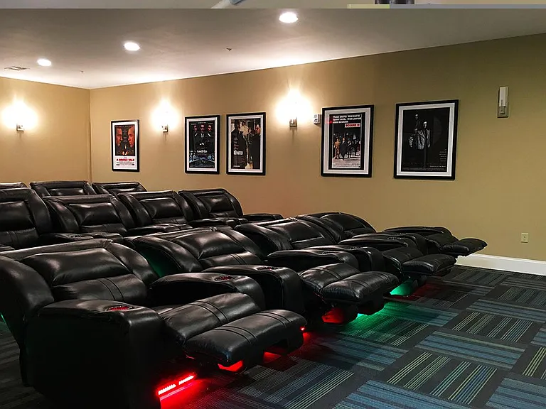 Theatre room with big screen TV & cinema-style seating
