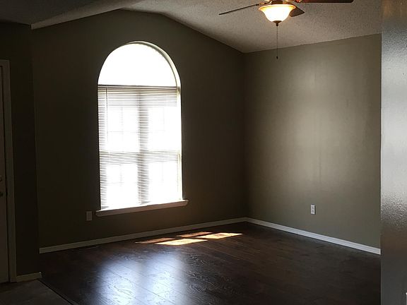 front room, cathedral window, vaulted ceiling, spacious 14 X16, laminate hardwood