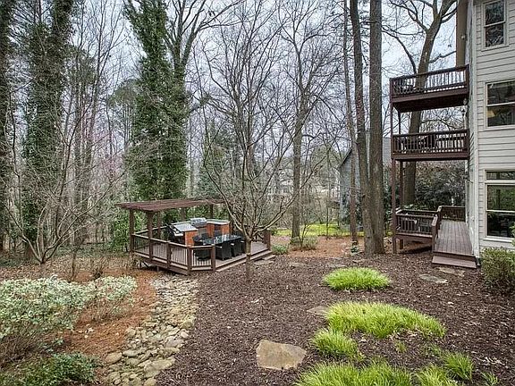 The house has a deck per level (for level), plus a deck in the backyard for a total of four decks.