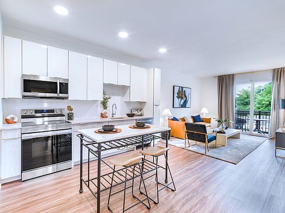 Experience culinary excellence in Modera Montville's gourmet kitchens, adorned with sleek quartz countertops and stylish tile backsplashes.