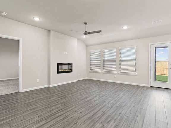 Living room in the Emmy II home plan by Trophy Signature Homes - REPRESENTATIVE PHOTO