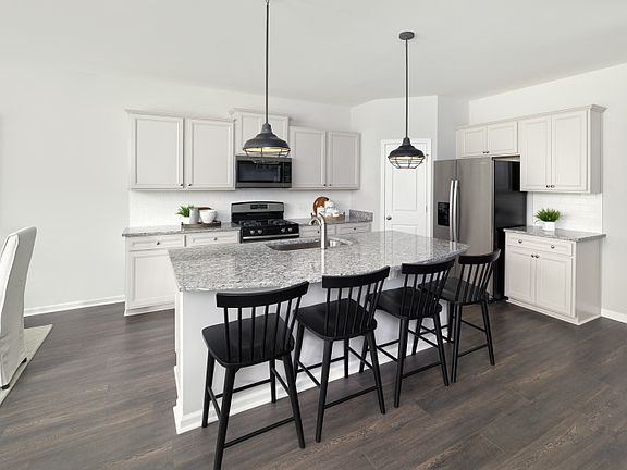 Spacious kitchen that includes a large Island