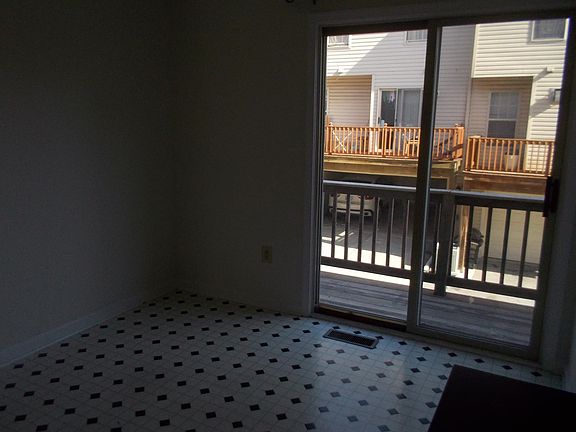 Kitchen eating area with sliders leading to deck
