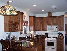 Kitchen with granite counters; travertine floors