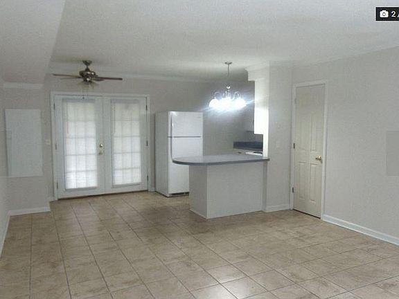 Front Room, dining, doors leading out to patio and closet.