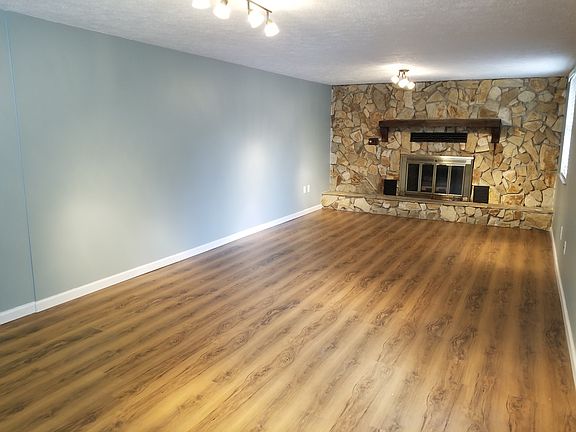 Stone fireplace in Den 