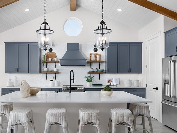 Kitchen with pendant lighting and floating shelves