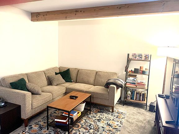 Living room with Beam Ceilings