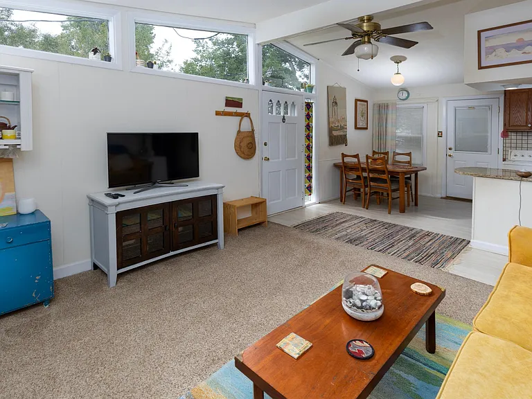 Living room with bar area and tv with Roku streaming