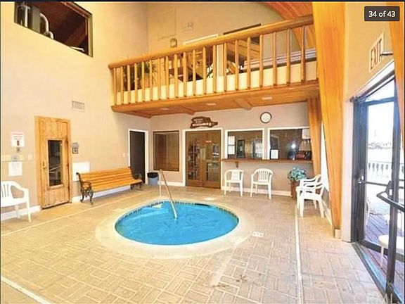 At community center - dry spa and hot tub- entrance to community room and upstairs window of exercise room