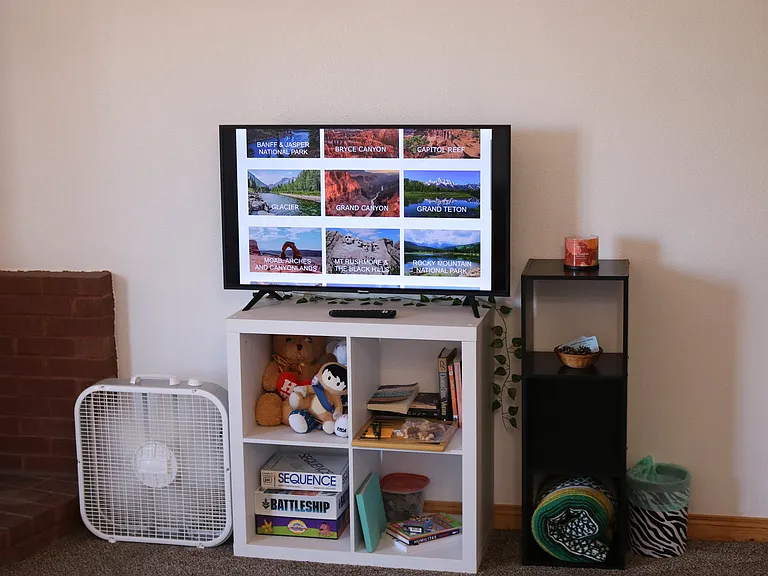 Entertainment center with ROKU TV and games.