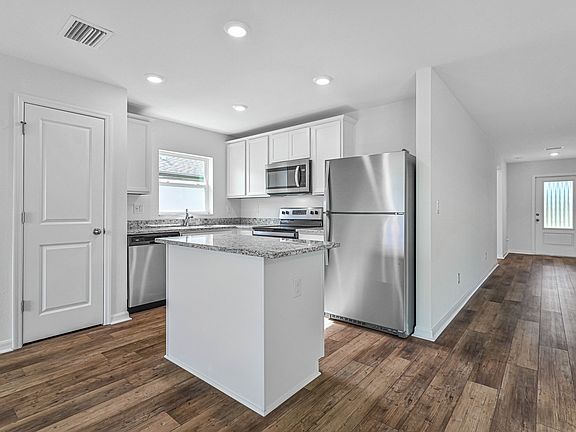 The kitchen is chef ready with stainless steel appliances