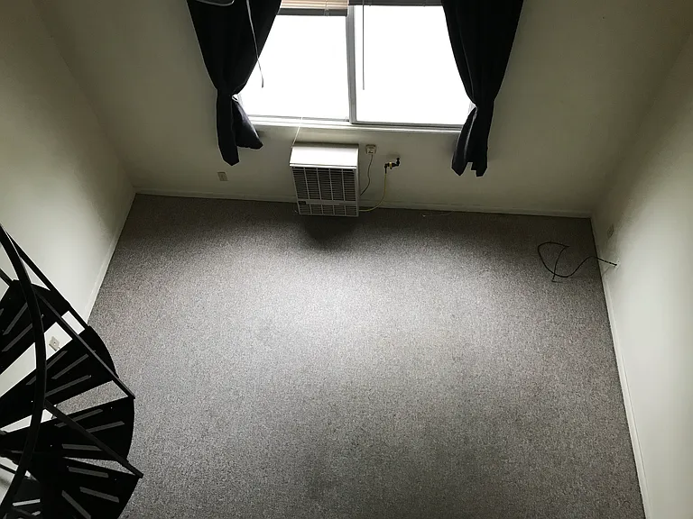 Looking down into living room from loft.