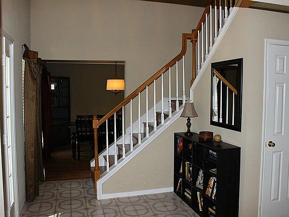 Spacious foyer with solid wood staircase