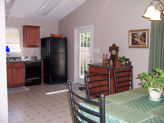 Dining area looking into kitchen