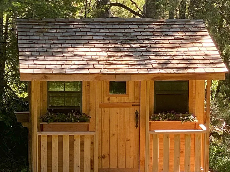 mini cabin playhouse on property for the youngsters
