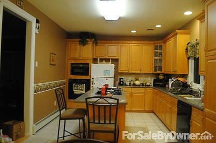 Kitchen
						:
						Maple cabinets, with Corian Countertop
GE Profile Cooktop, & Oven.