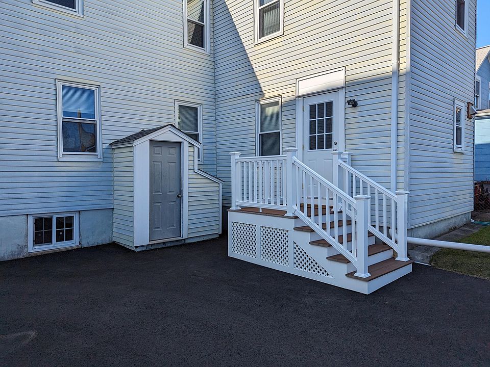 New deck added for entry via parking lot. Composite decking with vinyl railings and new entry door.