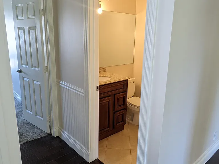 Half bath across from the office (or forth downstair bedroom