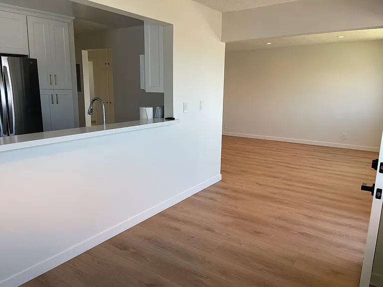 Dining area with living room in background.