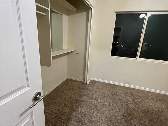 Bedroom 3 has full closet and custom mirrors.