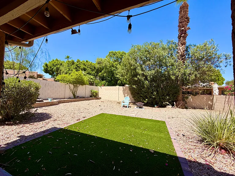 Fully fenced backyard. Turf and gravel. Plants are on irrigation.