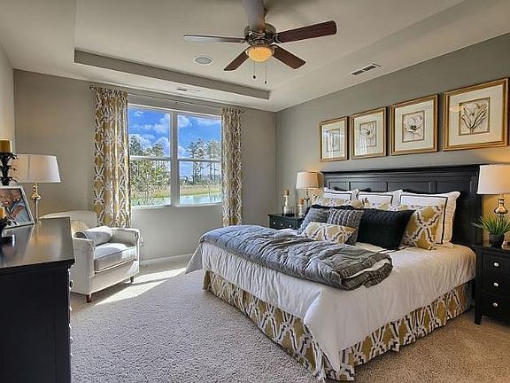 Master Bedroom, wit tray ceiling, display is king size bed. Walk into an upgraded master bath with large shower, double sinks, and large linen clothest.