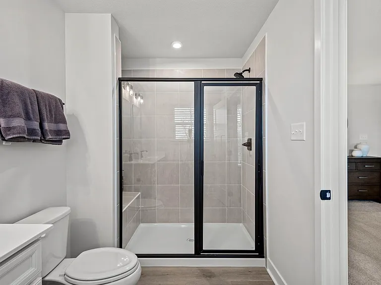 Roman shower with dual controls and bench seat