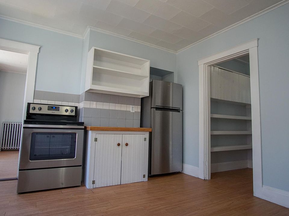 Kitchen with newish fridge and range